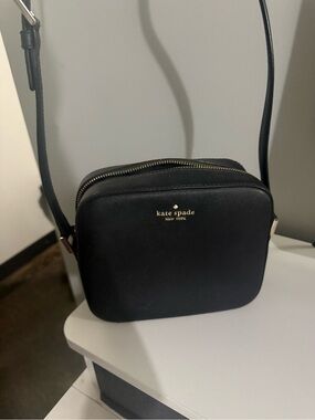 kate spade black crossbody camera bag with gold logo